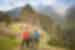 Three Intrepid travellers standing in front of Machu Picchu, Peru