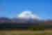 Wide view of Mount Ruapehu against a blue sky backdrop in Tongariro National Park, New Zealand