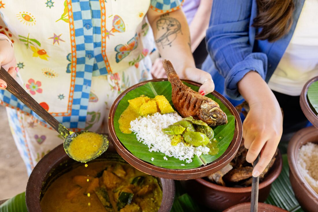 Plate of fried fish with rice at the Chena Cultivation Tour in Dambulla, Sri Lanka