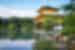 Kinkaku Ji Temple surrounded by forest in Kyoto, Japan