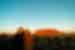 Intrepid travellers pose happily together during a sunset viewing at Uluru in Northern Territory Australia