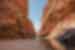 Hiker walking through West Macdonnell ranges, NT, Australia