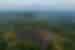 Borobudur Temple in the rainforests of Java, with Merapi volcano beyond