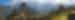 Clouds rising above the mountains behind. the ruins of Machu Picchu, in Peru