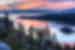 Panoramic view of a colorful sunrise over Emerald Bay and Eagle Point off Lake Tahoe in California.