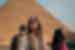 Travellers in front of a Pyramid in Giza, Cairo, Egypt