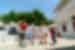 Leader chefs and traveller take a quick dance break while cooking class lunch bakes on Naxos in the Greece Cyclades
