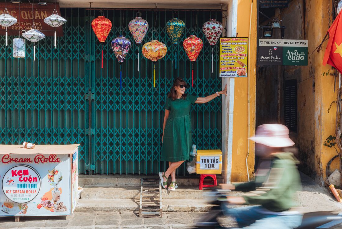 Traveller poses for a photo in the old town of Hoi An, Vietnam