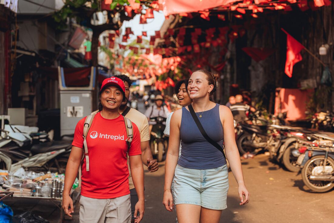 Intrepid Leader exploring with travellers in Old City Hanoi, Vietnam