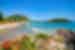 Beachside with Mount Maunganui and Moturiki island in the background on a sunny day, Tauranga, New Zealand