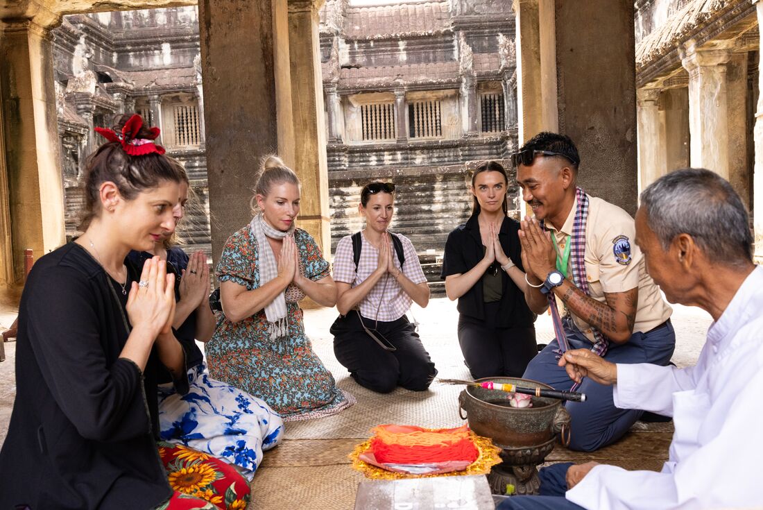 A moment of blessing with a monk in Angkor Wat