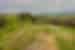 Distant view of Female traveller walking along Hadrian's Wall on a gloomy day in England, U.K.