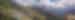 View of city on the side of a mountain in Nepal, on a cloudy day