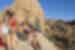Female travellers resting on rocks in Joshua Tree National Park, California, U.S.A.