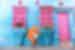 Traveller smiling in front of bright blue and pink building in Cartagena, Colombia