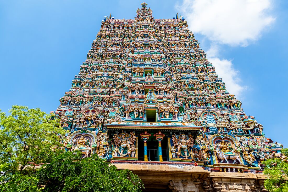 The incredible Sri Meenakshi Temple in Madurai, a detailed facade of devas and asuras alike carved and painted