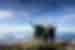 Intrepid Travellers throw their hands up as they take a group photo at the summit of Mount Kinabalu in Borneo