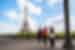 Travellers walk by the Eiffel Tower with Intrepid Leader