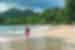 Intrepid traveller strolling the beach of Manuel Antonio National Park in Costa Rica