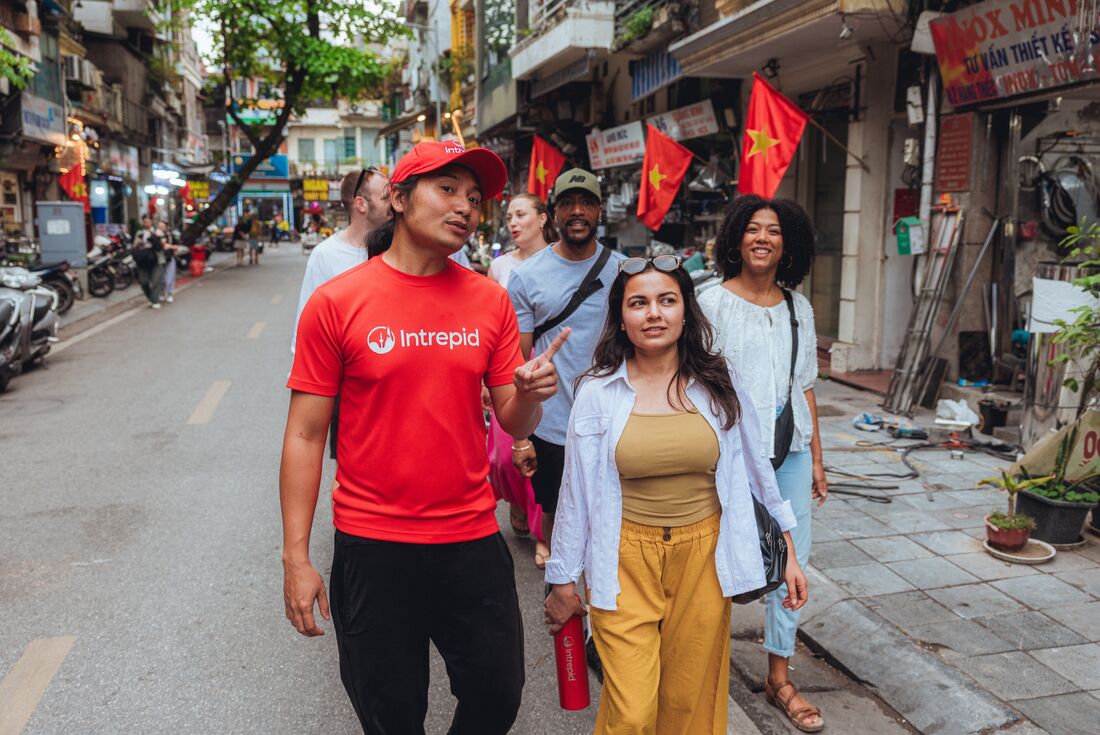 Leader taking travellers out on a city walk in Hanoi, Vietnam