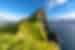 The tiny Kallur Lighthouse atop Kalsoy Island