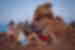 Group of travellers watching the sunset in Arches National Park, Utah, U.S.A.