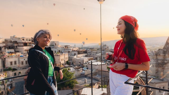 An Intrepid leader and traveller sip tea in Cappadocia