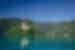 Green waters of Lake Bled and view of church on island