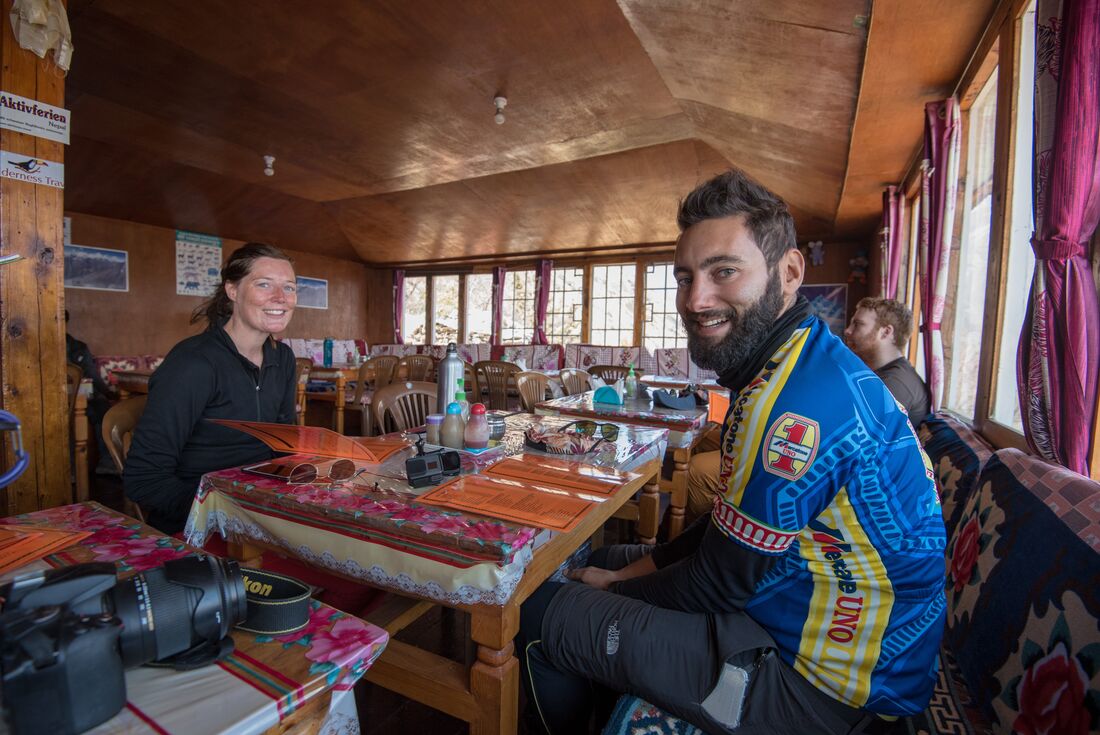 Stopping at a teahouse at the end of a long day hiking through Himalayan mountains