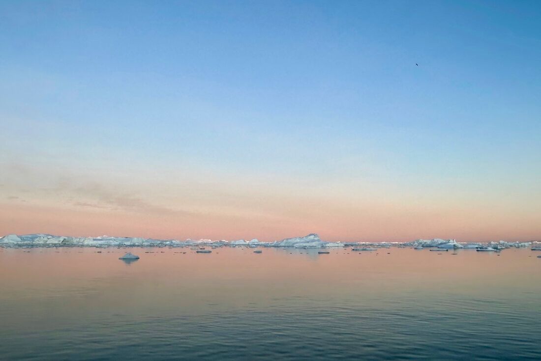 Sunset refracted off Disko Bay and its many icebergs