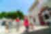 Intrepid leader and traveller take a break from cooking class to dance with chefs in Cyclades