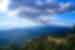 Panoramic landscape of Oaxaca's forested hills and clouds sweeping overhead in Mexico