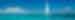 Sailboat on the water in the tropics under bright blue skies