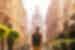 Traveller approaches St Stephen's Basilica down a planted street in Budapest in summer