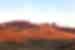 Sunset on the Ashhatu Stone Forest near Reshui highlights the rolling landscape of Inner Mongolia