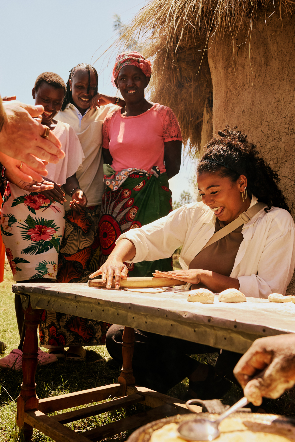 A traveller sits rolling dough in Tepesua village.