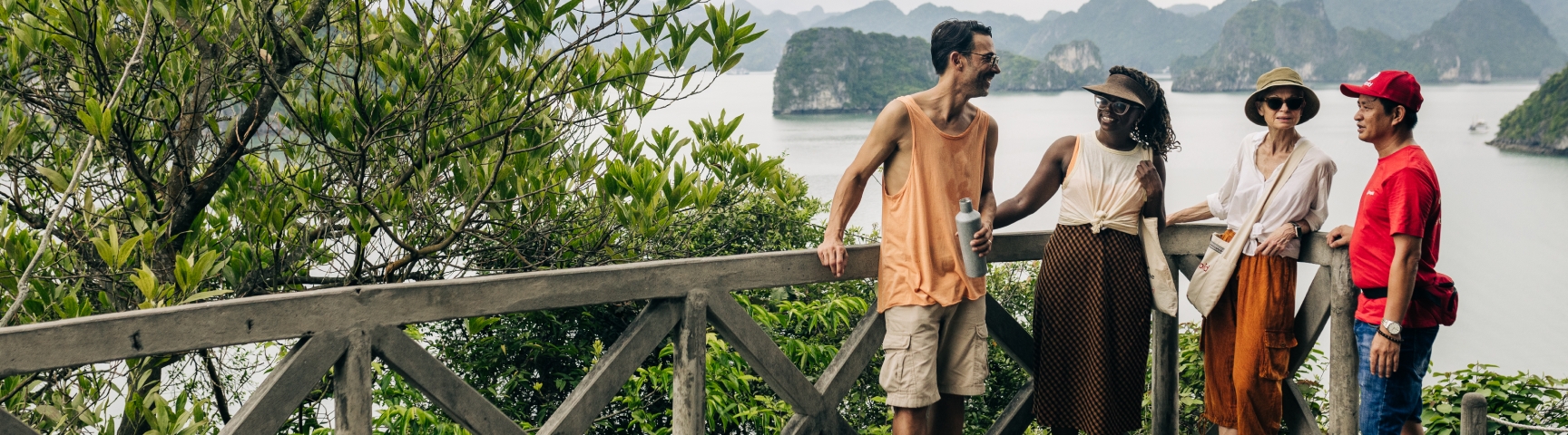 Four people in Halong Bay smiling