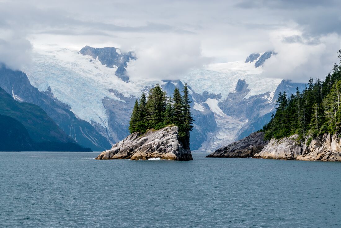 View of island with glacier in the background at Kenai Fjords National Park