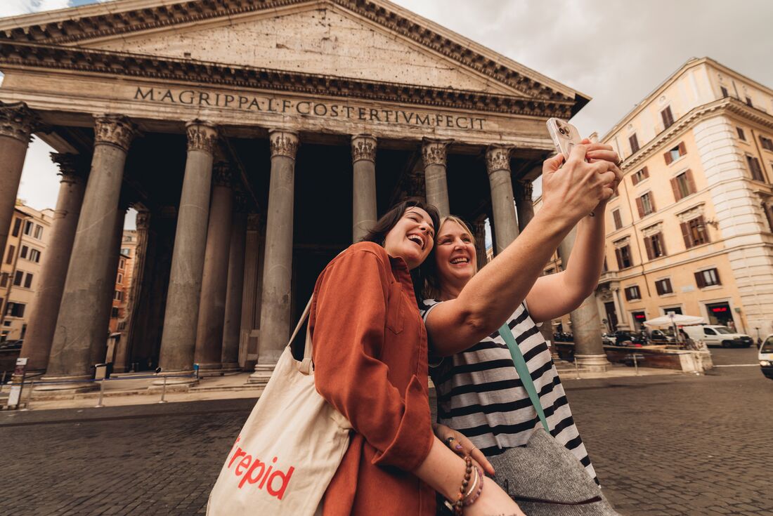 Travellers take a selfie in front of the Pantheon in Rome, Italy