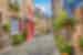Cobble stone streets and houses with plants, Normandy, France