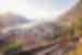 Travellers walk up steps to lookout over Koto harbour and city