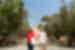 Intrepid leader and traveller walk toward a ruin monument in Athens Greece